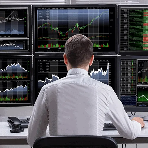 man at trading desk